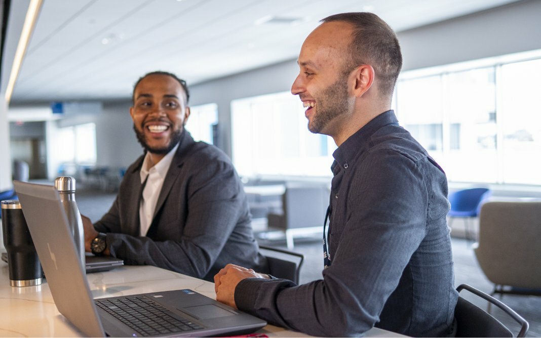 Two Men Laughing with One Another